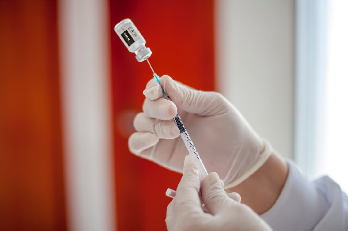 Close-Up Shot of a Vial on a Syringe 